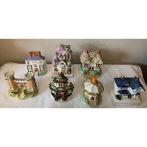 121 - Ten Staffordshire cottages to include money boxes and pastille burners, some 19thC.