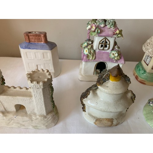 121 - Ten Staffordshire cottages to include money boxes and pastille burners, some 19thC.