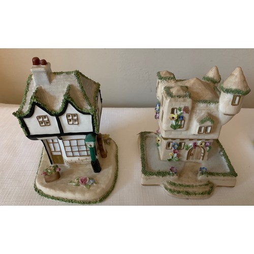 122 - Seven various Coalport cottages to include 