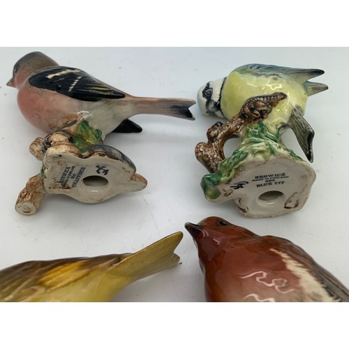 123 - Four Beswick birds to include Blue Tit, Greenfinch, Chaffinch and Robin.