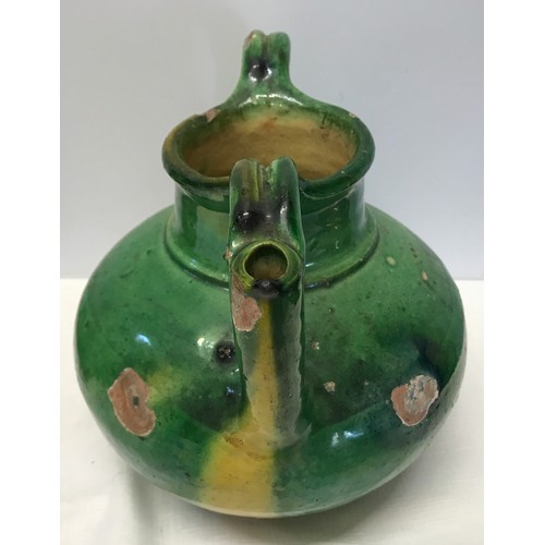 127 - A green glazed pottery two handled jug from Provence circa 1850 approx. 21cms h x 24cms w.