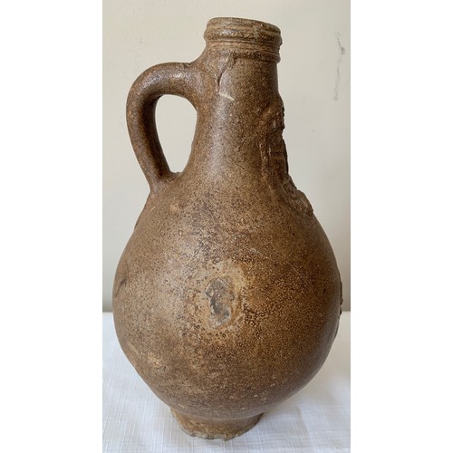 129 - A late 17thC salt glazed stoneware Bellarmine jug 26cms h, unearthed by a farmers plough in Holderne... 