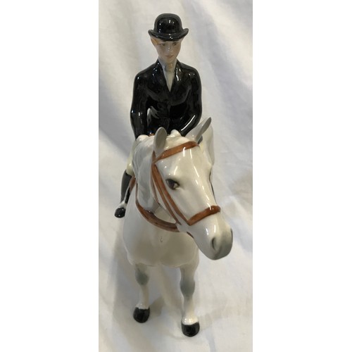 146 - A Beswick Huntswoman on white/grey dappled horse. Approx. 21.5cms h x 21cms l.