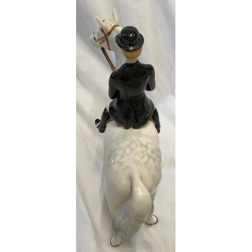 146 - A Beswick Huntswoman on white/grey dappled horse. Approx. 21.5cms h x 21cms l.