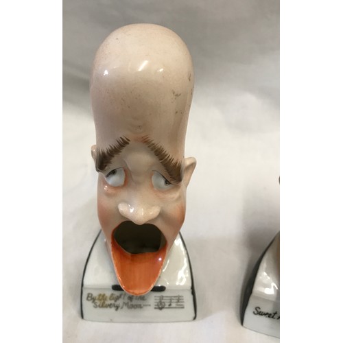 203 - Three novelty singing head ashtray to include 