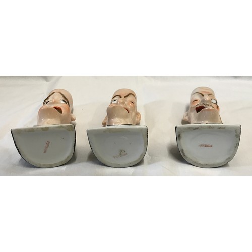 203 - Three novelty singing head ashtray to include 