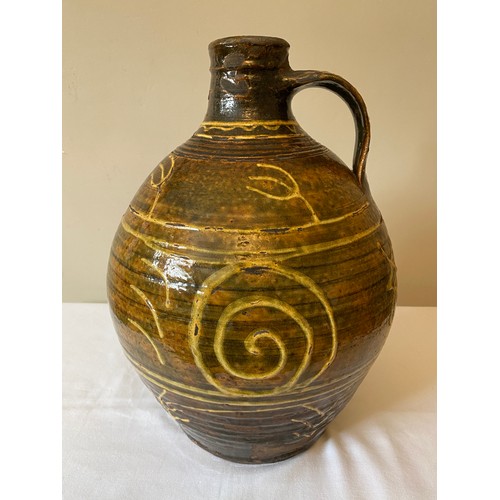 204 - A Michael Cardew Winchcombe Studio Pottery slipware cider flagon with Winchcombe seal marks to base.... 