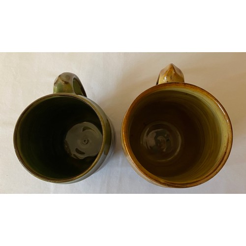 205 - Two Pat Groom Winchcombe Pottery mugs. 15cms and 11.5cms h.