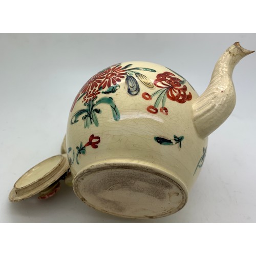 222 - An 18thC Creamware teapot a/f to spout. 18cms l x 11cms h.