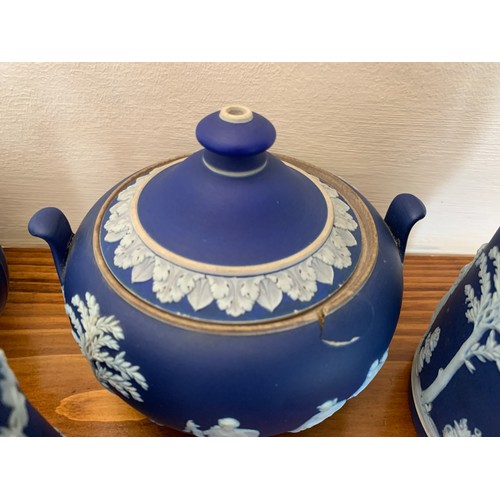 223 - A Wedgwood Jasperware teapot, hot water jug and sucrier.