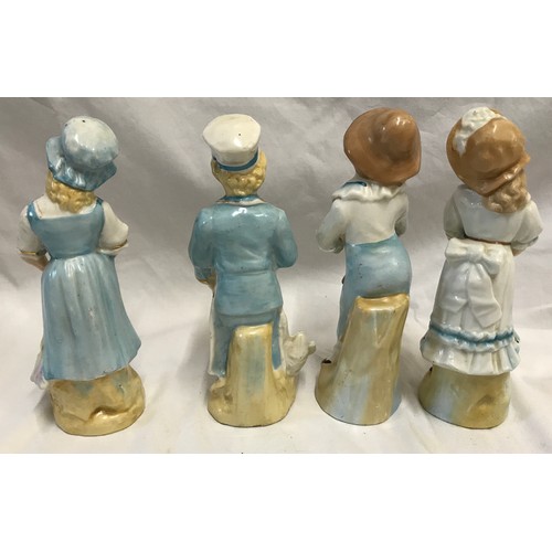 236 - Two pairs of continental pottery figurines. Boy and Girl with brollies 18cms h and maid and cook 18c... 