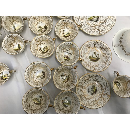 243 - A Rockingham seaweed porcelain part tea service, some pieces bearing the puce factory mark Rockingha... 