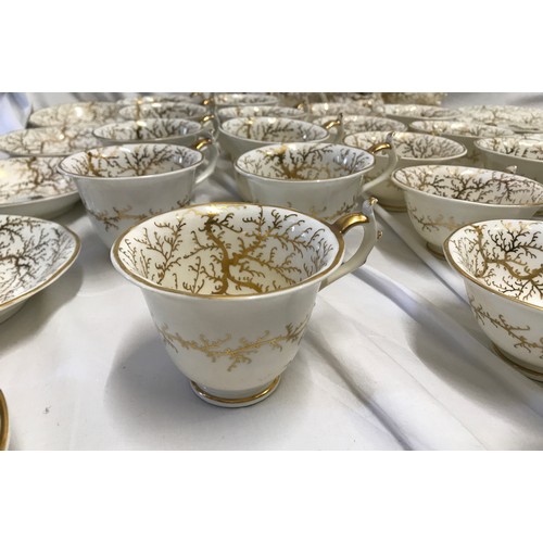 243 - A Rockingham seaweed porcelain part tea service, some pieces bearing the puce factory mark Rockingha... 