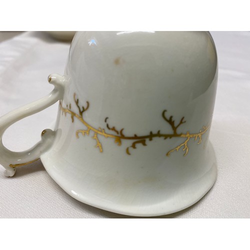 243 - A Rockingham seaweed porcelain part tea service, some pieces bearing the puce factory mark Rockingha... 