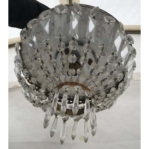 253 - A small two tiered chandelier with symmetrical cut glass pendants. To take a single bulb. 30cm w x 2... 