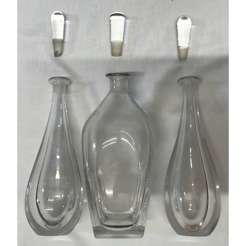 258 - Three Mid Century heavy glass decanters with indistinct marks to base. A pair with raindrop shape 29... 