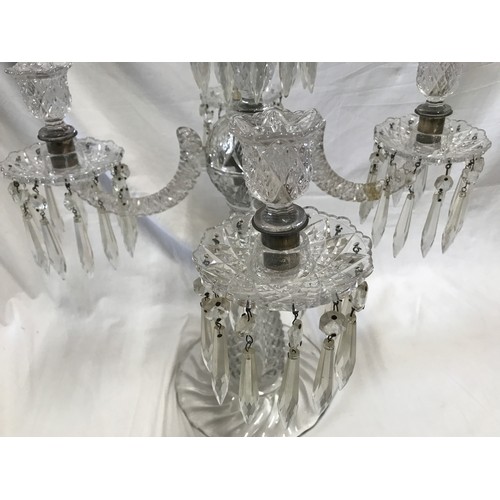 264 - A large glass five branch candelabra, 59cm h x 47cm w, base width 22cm.