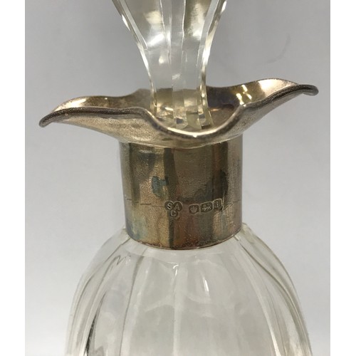 267 - Hallmarked silver collared glass decanter. S.A.C. Sheffield 1926. Height with stopper 28cm.