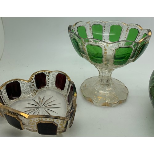 273 - A 19thC green glass dump with bubbles and 2 glass and gilt decorated dishes.