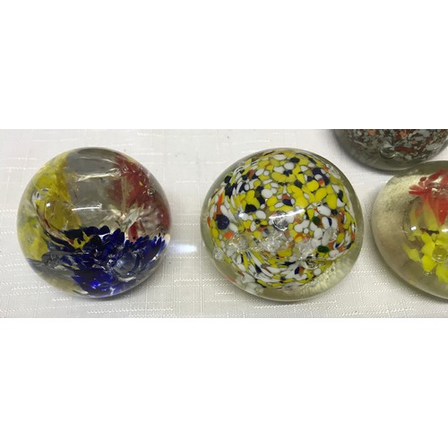 283 - A collection of 22 unmarked glass paperweight, floral, bubble, multicoloured etc.