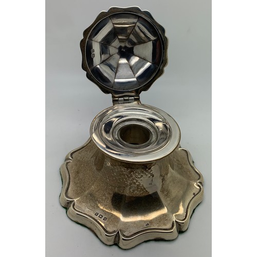 303 - A Birmingham silver inkwell 1919. 344gms total weight. 12cms d.