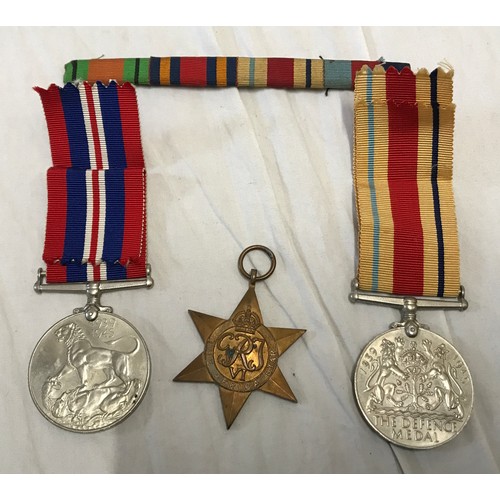 891 - A WWII group of 3 medals to include The Defence Medal, The African Star and a Campaign together with... 