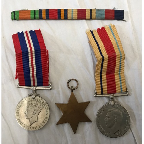 891 - A WWII group of 3 medals to include The Defence Medal, The African Star and a Campaign together with... 