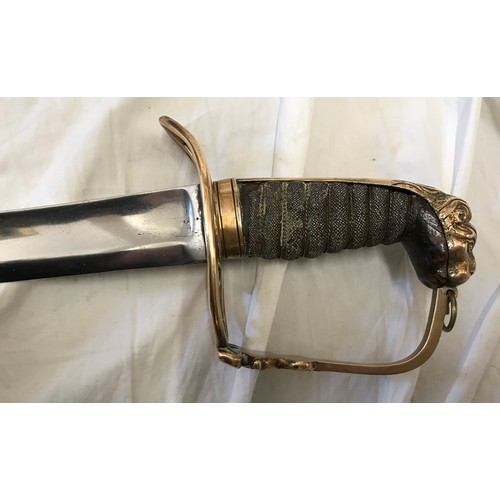 893 - A light cavalry sword circa 1800 with brass lions head handle. Blade length approx. 76cms, overall l... 