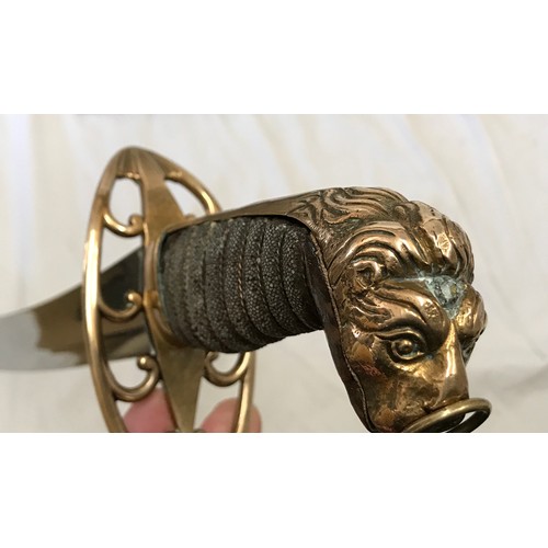 893 - A light cavalry sword circa 1800 with brass lions head handle. Blade length approx. 76cms, overall l... 