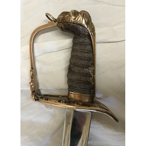 893 - A light cavalry sword circa 1800 with brass lions head handle. Blade length approx. 76cms, overall l... 