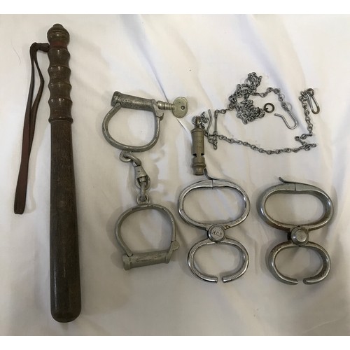 895 - Policeman's truncheon, two pairs of handcuffs Hiatt maker, one with HCP stamp and a Metropolitan whi... 