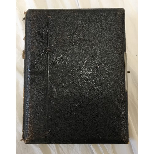 901 - A leather bound early 20thC photo album with bordered pages  containing photographs of family portra... 