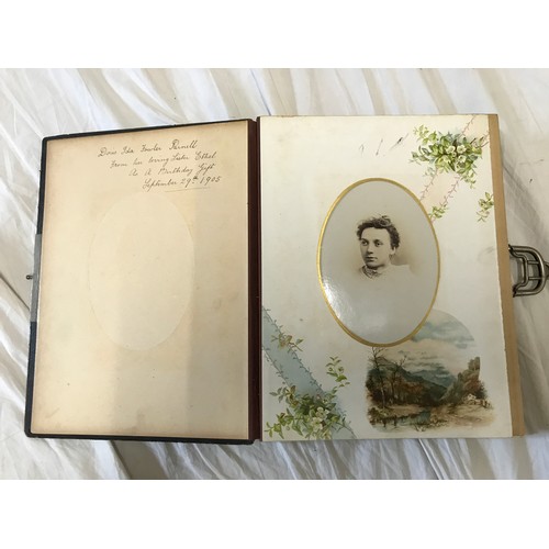 901 - A leather bound early 20thC photo album with bordered pages  containing photographs of family portra... 