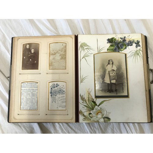 901 - A leather bound early 20thC photo album with bordered pages  containing photographs of family portra... 