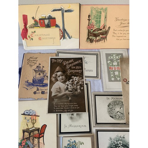 907 - A collection of early 20thC greetings cards and photographs.