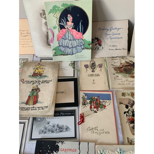 907 - A collection of early 20thC greetings cards and photographs.