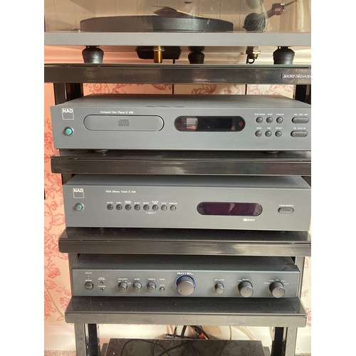 912 - A NAD sound system with Linn speakers mounted on Atacama stands. To include a CD player model C520 a... 