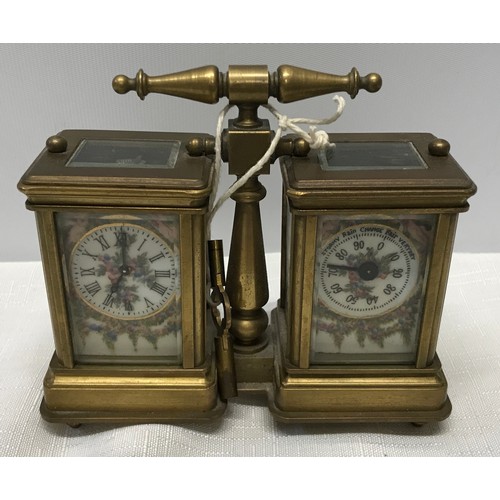 922 - A small brass carriage clock and barometer with carry handle and double key and painted pottery pane... 