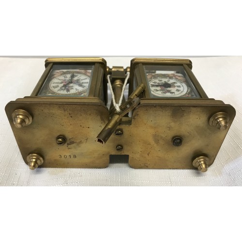 922 - A small brass carriage clock and barometer with carry handle and double key and painted pottery pane... 