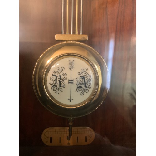 923 - A 19thC mahogany Vienna wall clock with brass and enamel dial and pendulum. 99cms h x 35cms w.