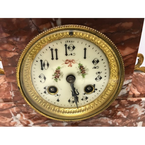 925 - A garniture clock set comprising of a marble cased clock with bronzed spelter figure and 