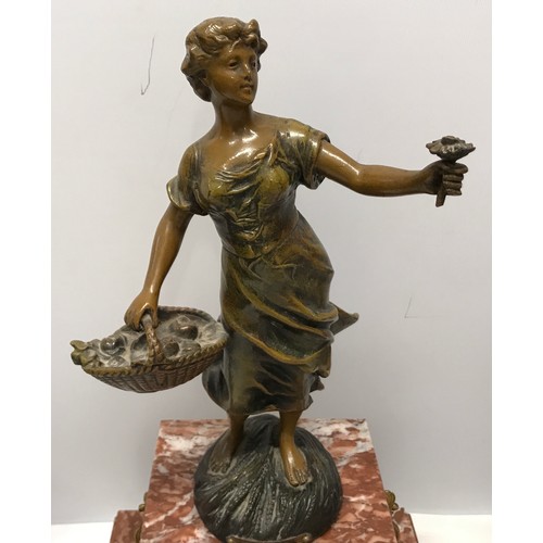 925 - A garniture clock set comprising of a marble cased clock with bronzed spelter figure and 