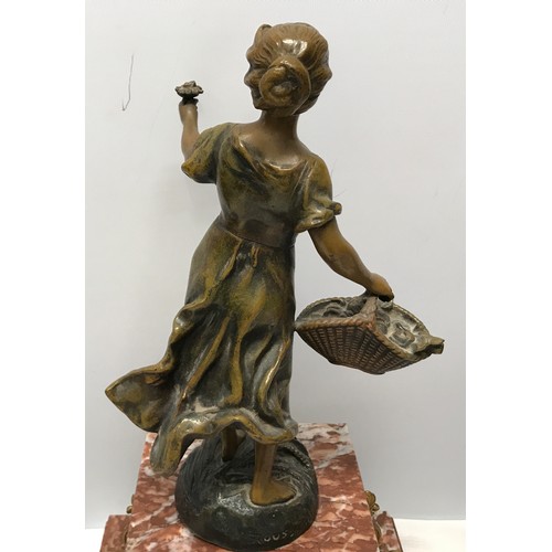 925 - A garniture clock set comprising of a marble cased clock with bronzed spelter figure and 