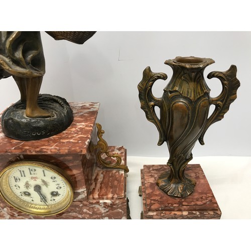 925 - A garniture clock set comprising of a marble cased clock with bronzed spelter figure and 