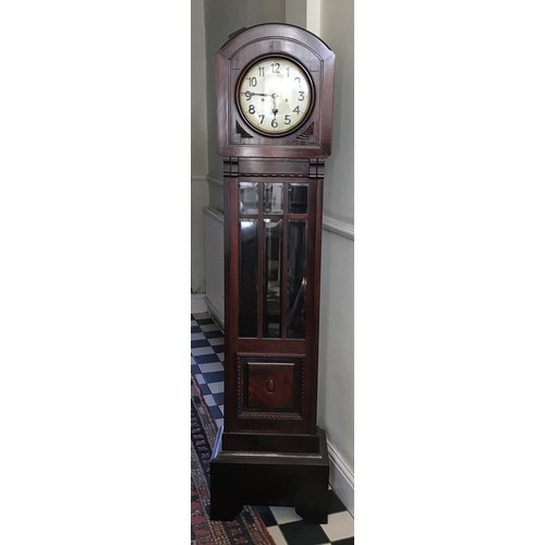 927 - A mahogany longcase clock with a bevelled glass panel door. 180cm h x 45cm w x 27cm d. Dial is 22cm ... 