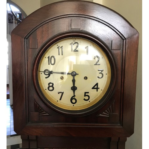 927 - A mahogany longcase clock with a bevelled glass panel door. 180cm h x 45cm w x 27cm d. Dial is 22cm ... 