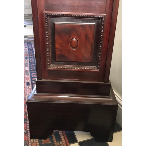 927 - A mahogany longcase clock with a bevelled glass panel door. 180cm h x 45cm w x 27cm d. Dial is 22cm ... 