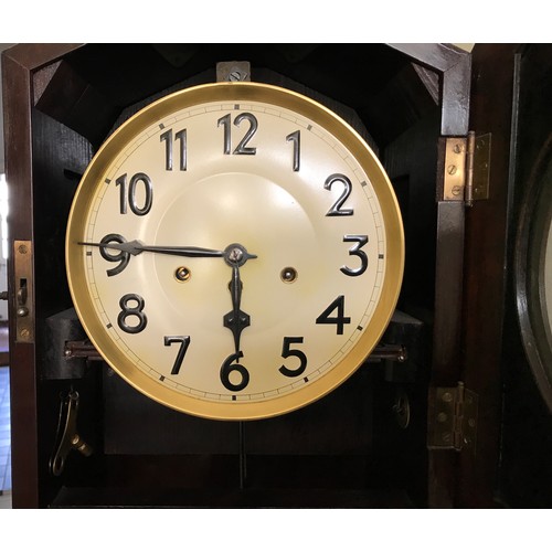 927 - A mahogany longcase clock with a bevelled glass panel door. 180cm h x 45cm w x 27cm d. Dial is 22cm ... 