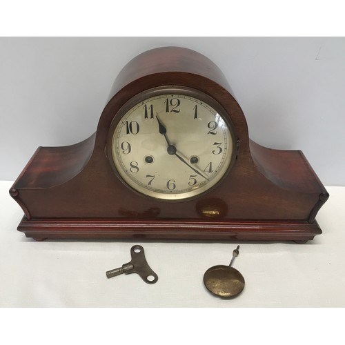 931 - A mahogany cased mantle clock  with DRM brass movement 25cms h  x 14cms d x 42cms w.  with a steel f... 