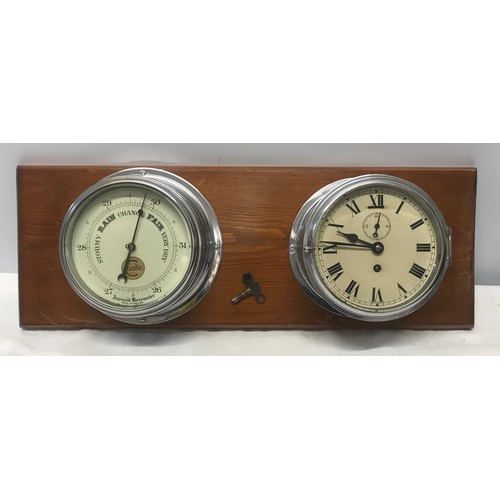 932 - A chrome cased ships clock and aneroid barometer mounted on pine by Cooke of Hull. Back plate width ... 